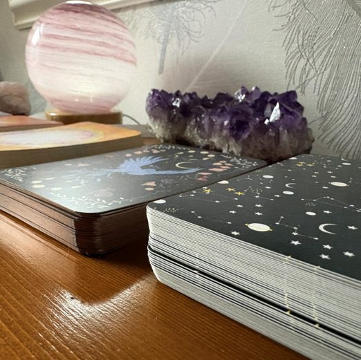Oracle cards and crystals on a desk